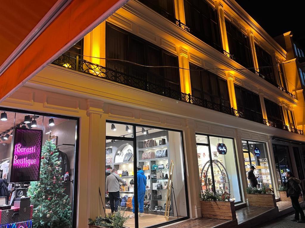 a store front with a christmas tree in front of a building at Berfinn Hotel Ortaköy in Istanbul