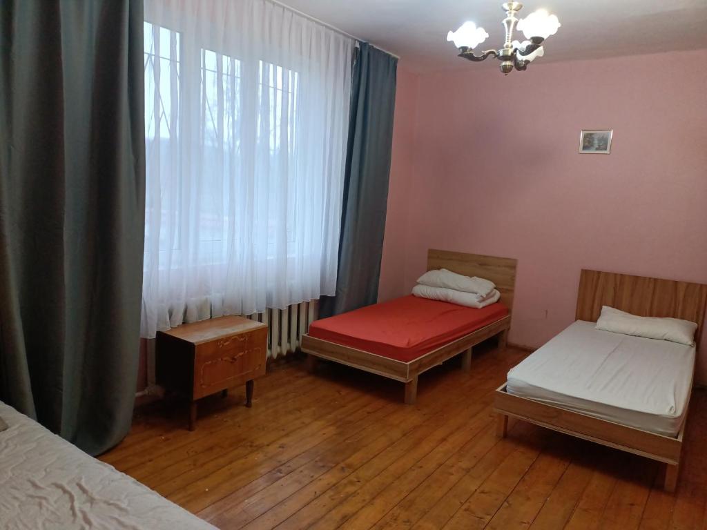 Postel nebo postele na pokoji v ubytování Krone Hostel