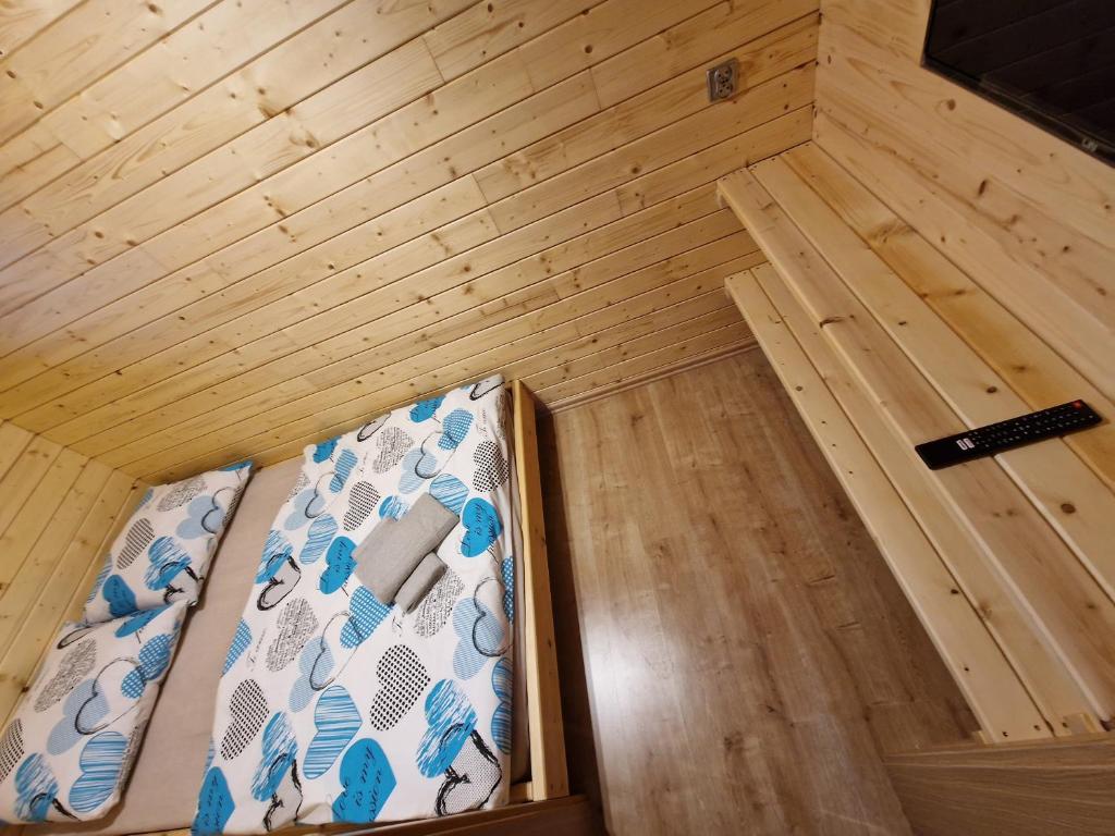 Posteľ alebo postele v izbe v ubytovaní Apartament z Tężnią Solankową, Sauną, Kominkiem LED i Śniadaniem nad Jeziorem Żywieckim