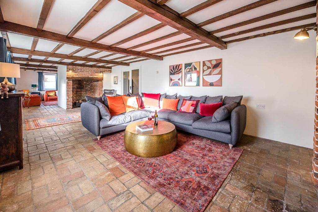 a living room with two couches and a coffee table at Solebay House in Woodbridge