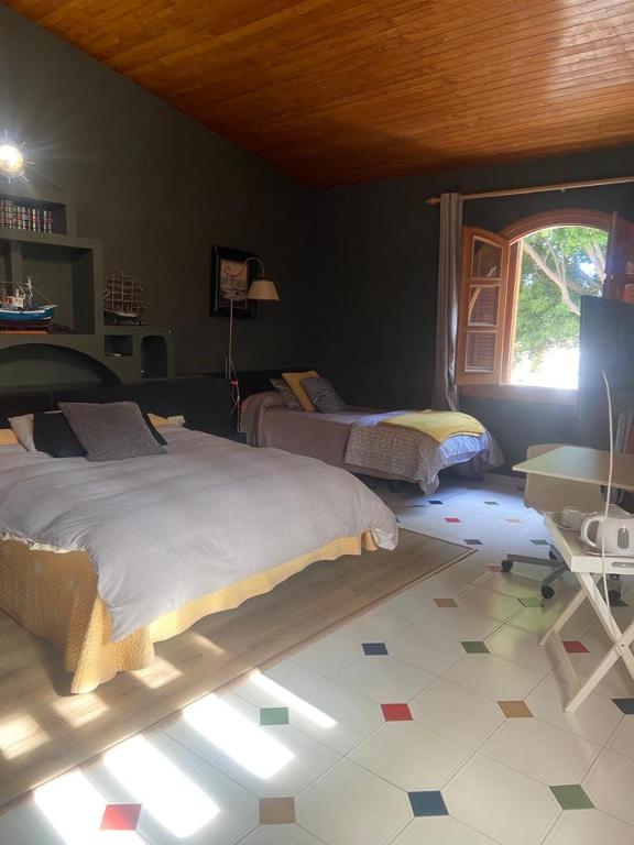 Postel nebo postele na pokoji v ubytování 16:9 Los Molinos Suites