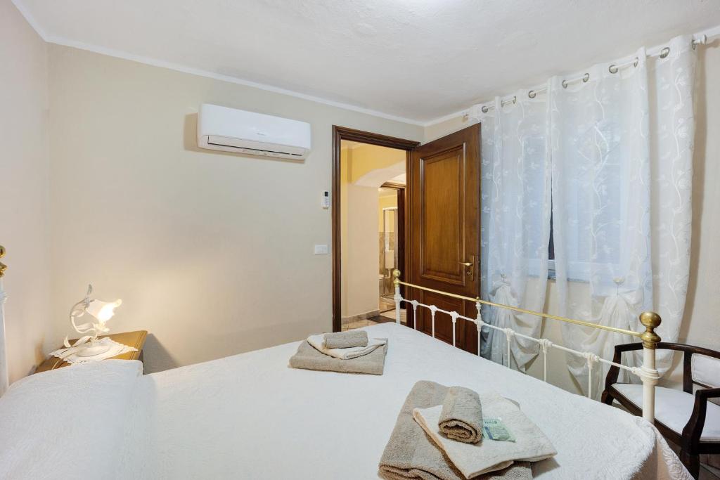 Postel nebo postele na pokoji v ubytování Agriturismo U'Spigu Nonna Annetta
