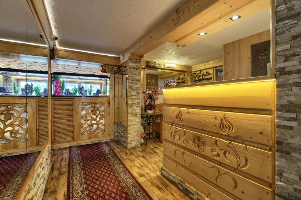 a large room with wooden floors and wooden cabinets at Zakopianka in Zakopane