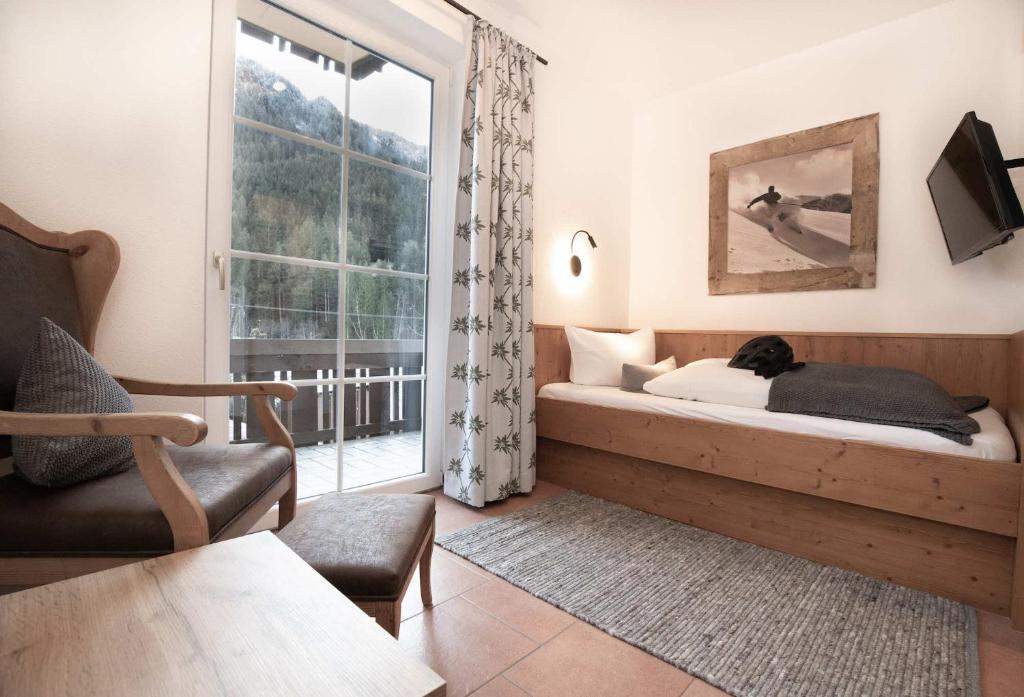 Postel nebo postele na pokoji v ubytování Hotel-Gasthof Der Wiesengrund