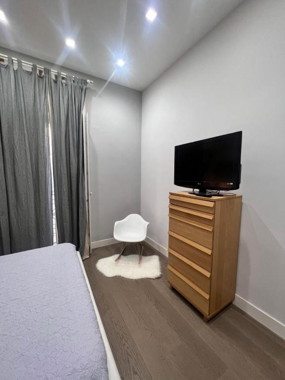 Telewizja i/lub zestaw kina domowego w obiekcie RaRoom Boutique Home