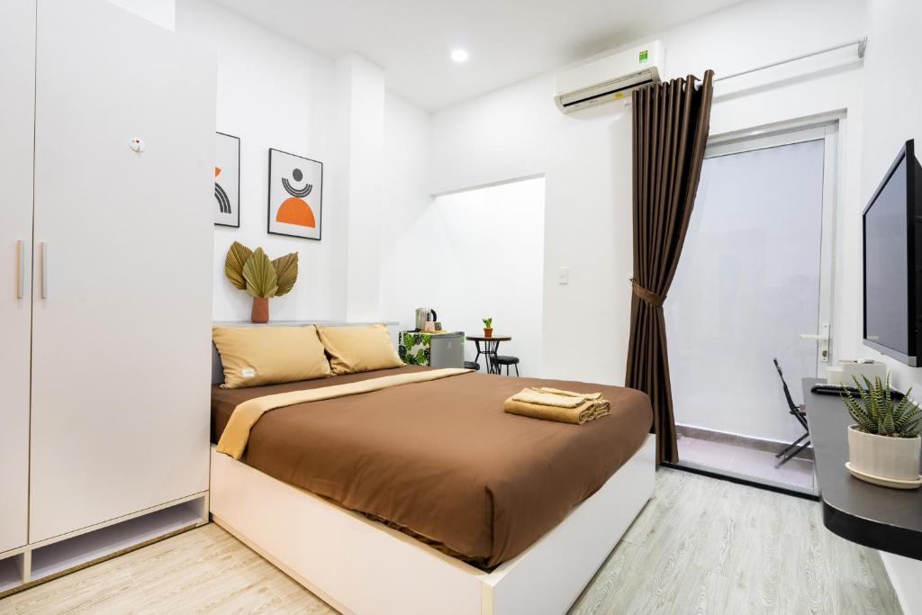 Giường trong phòng chung tại Ekomo Home - Central Saigon