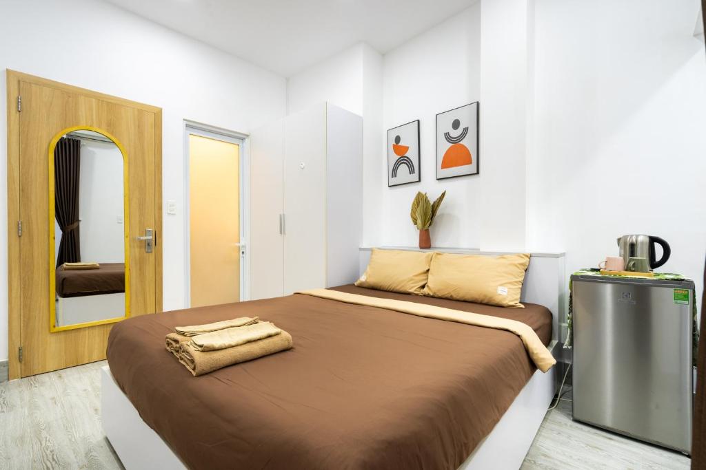 Giường trong phòng chung tại Ekomo Home - Central Saigon