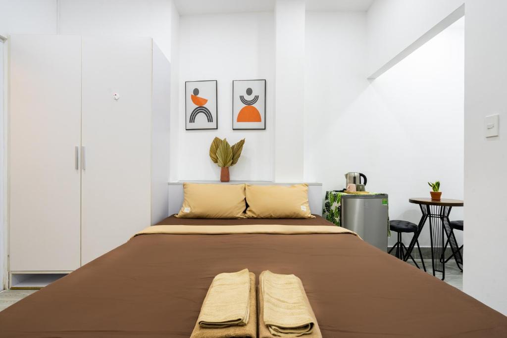 Giường trong phòng chung tại Ekomo Home - Central Saigon