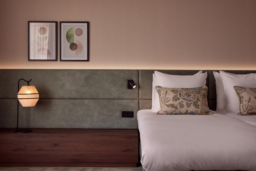 Postel nebo postele na pokoji v ubytování Van der Valk Hotel Lelystad
