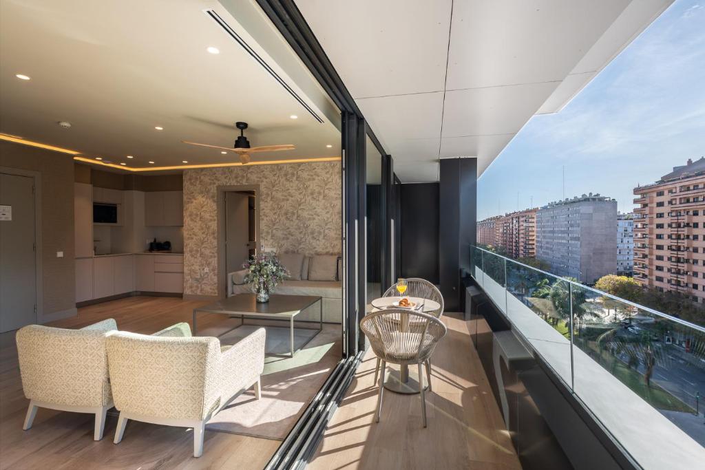 an apartment balcony with a view of a city at Apartamentos Core Suites Valencia in Valencia