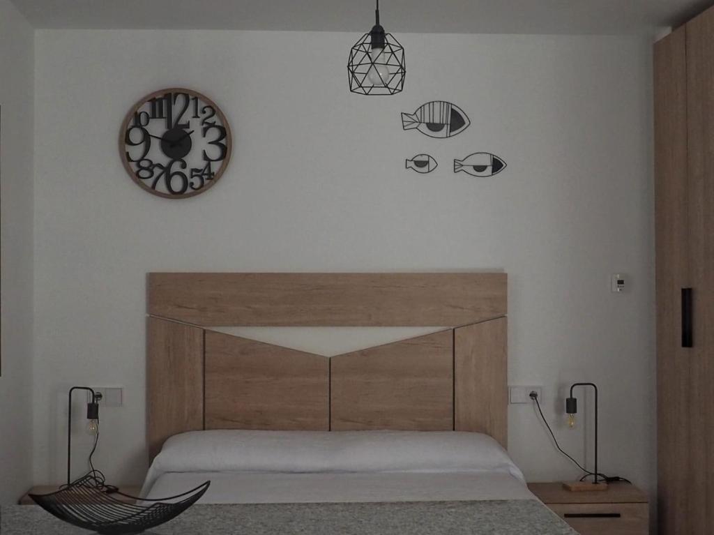 Posteľ alebo postele v izbe v ubytovaní El APARTAMENTUCO