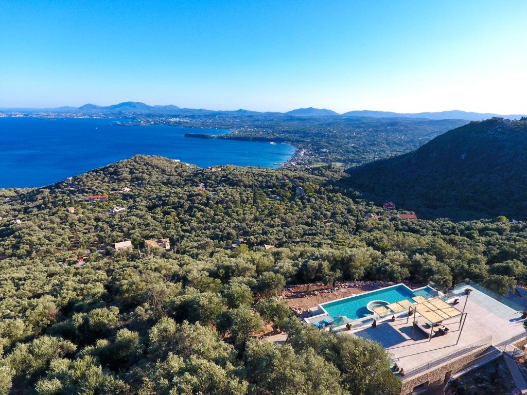 an aerial view of a villa with a swimming pool at Summerwine Luxury Villa Sea View Private Pool in Spartýlas