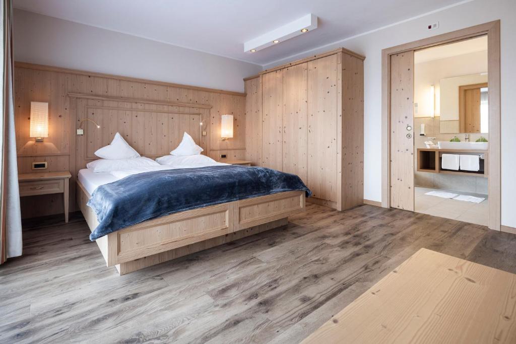 Postel nebo postele na pokoji v ubytování Hotel Baumwirt