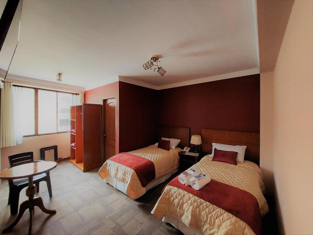 Ένα ή περισσότερα κρεβάτια σε δωμάτιο στο Hotel Boutique Vivenzo