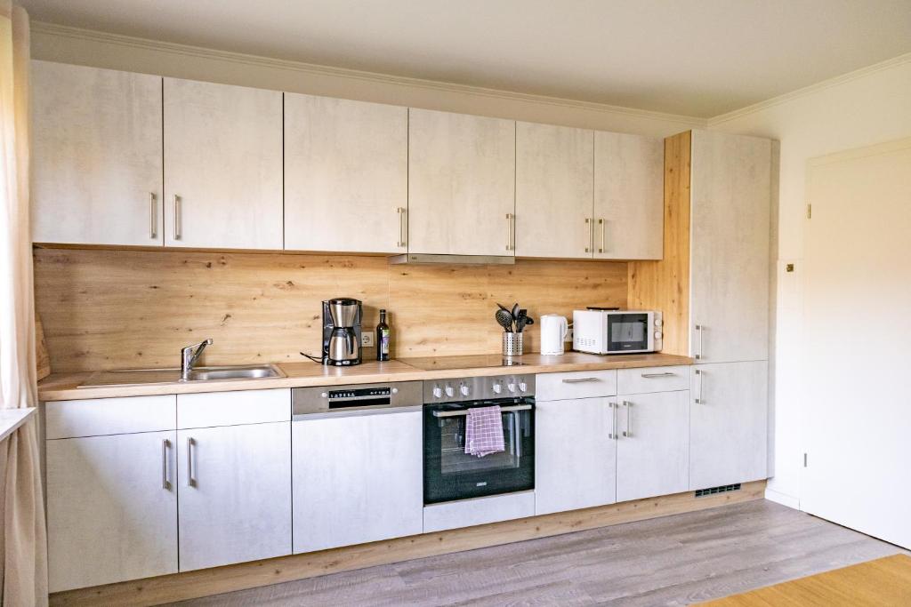 Kuchyň nebo kuchyňský kout v ubytování Ferienhaus Tidenkieker