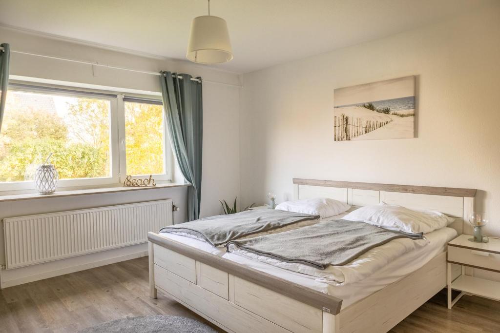 Postel nebo postele na pokoji v ubytování Ferienhaus Tidenkieker