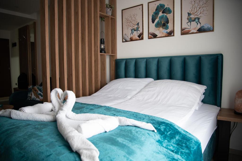 Postel nebo postele na pokoji v ubytování Apartman Larisa