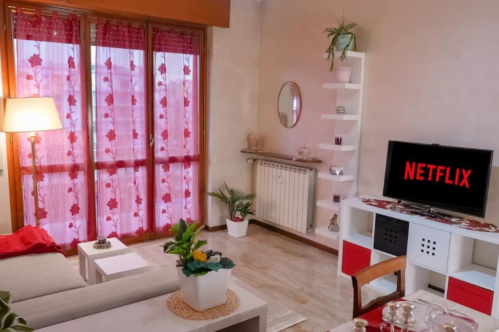 a living room with a couch and a tv at [Elegant Apartment] in Bergamo Center in Bergamo