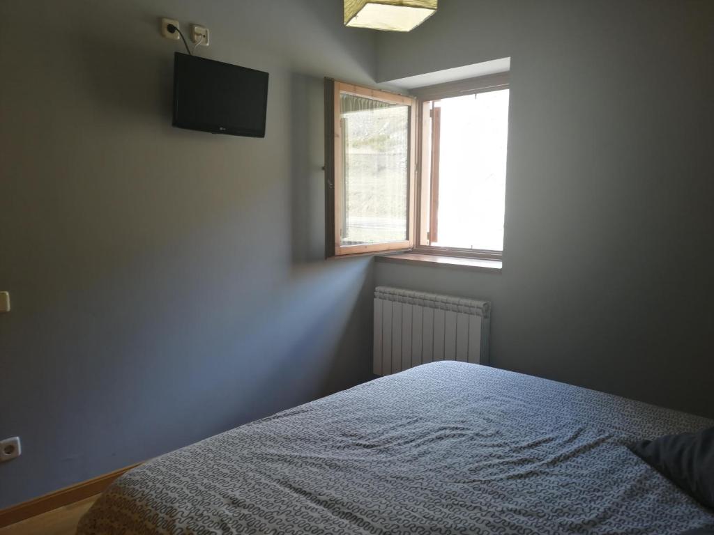 Postel nebo postele na pokoji v ubytování Apartamento Erta 1 a 8km de la estación de esquí