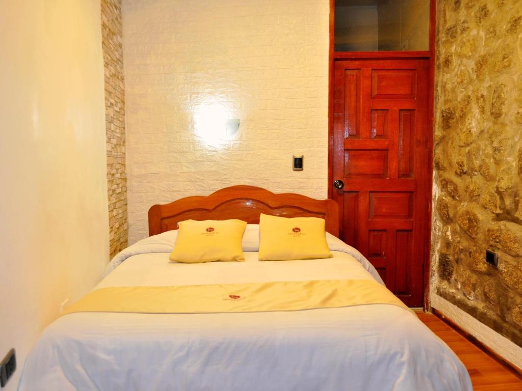 Postel nebo postele na pokoji v ubytování Hotel Choquequirao