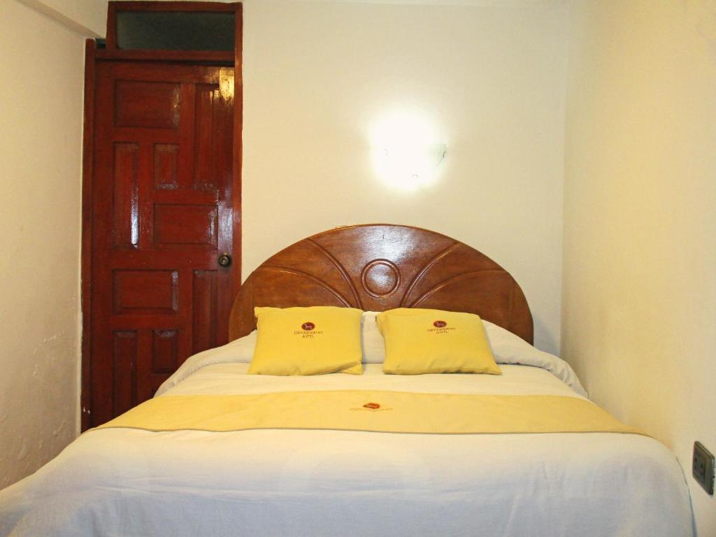 Postel nebo postele na pokoji v ubytování Hotel Choquequirao