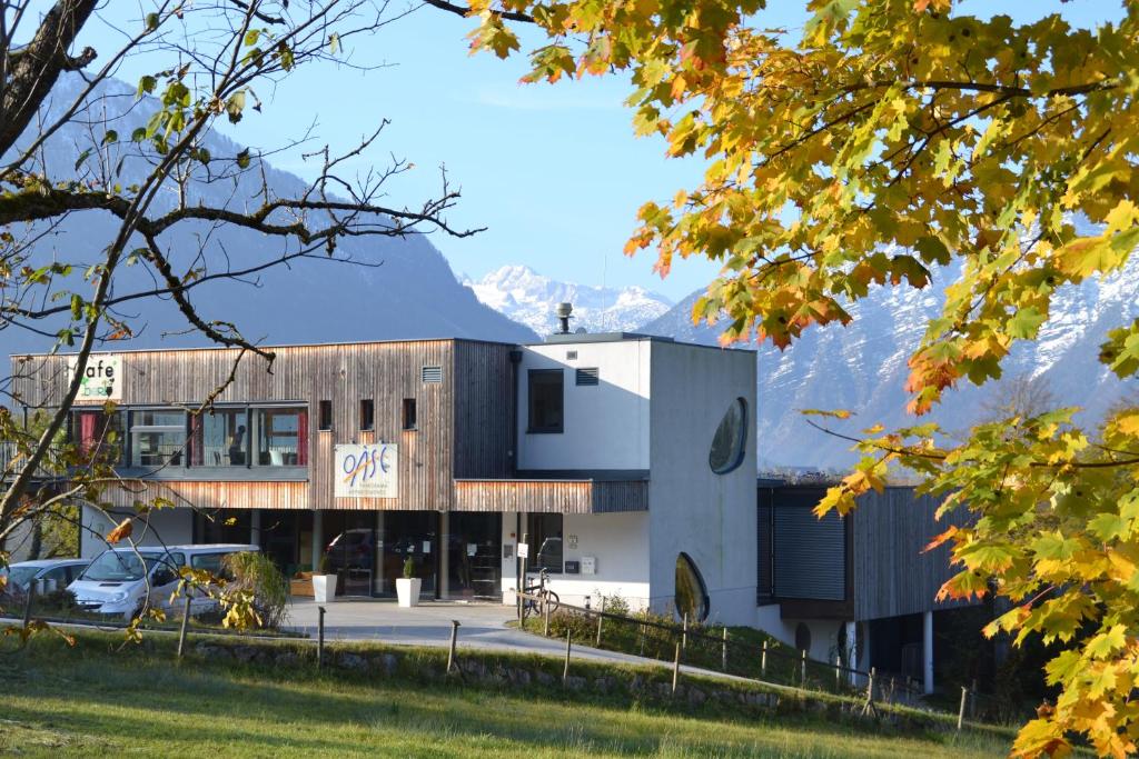 a building with mountains in the background at Oase Berta in Bad Aussee