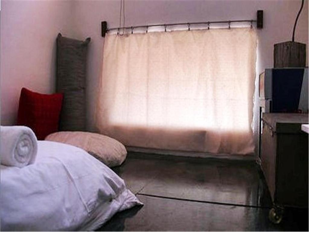 Postel nebo postele na pokoji v ubytování Kenting Sun Light Inn