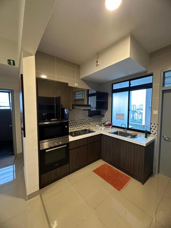 Kuchyň nebo kuchyňský kout v ubytování Ayer8 Putrajaya Guesthouse