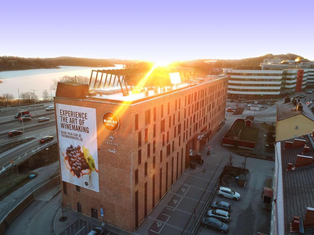 a building with a sign on the side of it at The Winery Hotel, WorldHotels Crafted in Solna