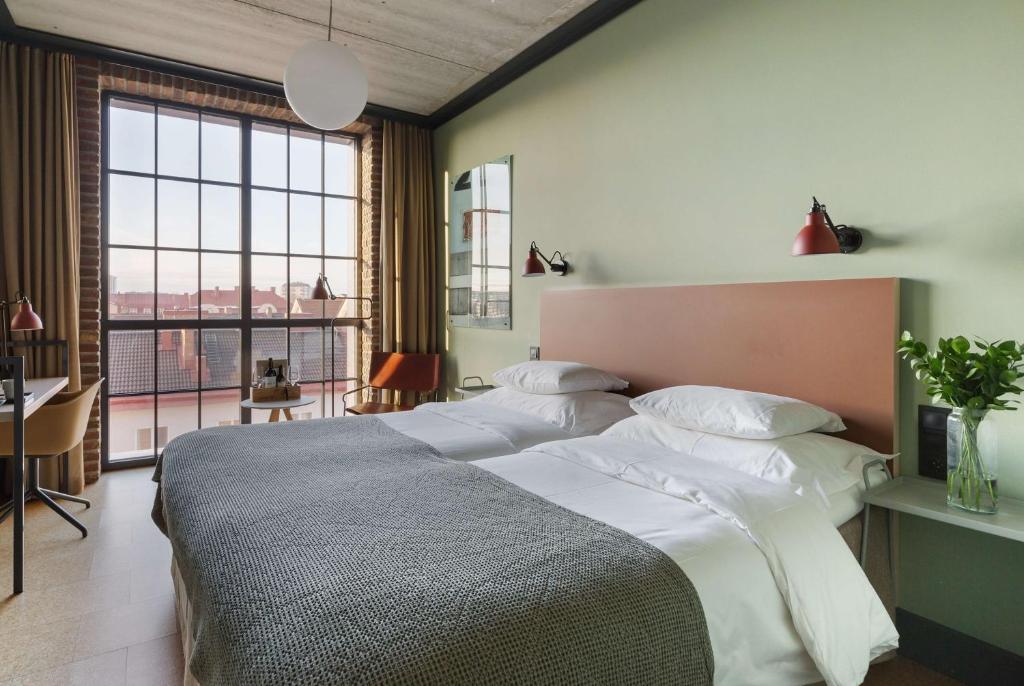 Postel nebo postele na pokoji v ubytování The Winery Hotel, WorldHotels Crafted