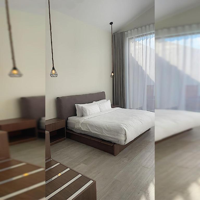 Postel nebo postele na pokoji v ubytování اكواخ سنتارا الريفيه