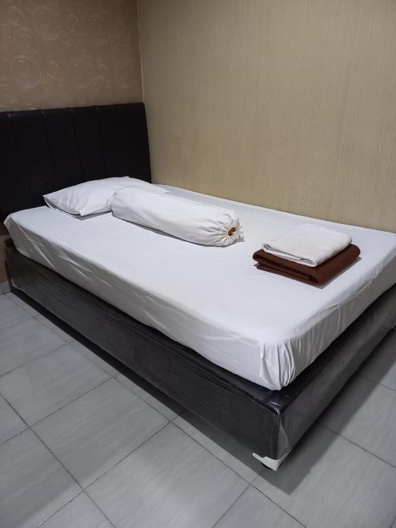 Postel nebo postele na pokoji v ubytování GRIYA BUNDA