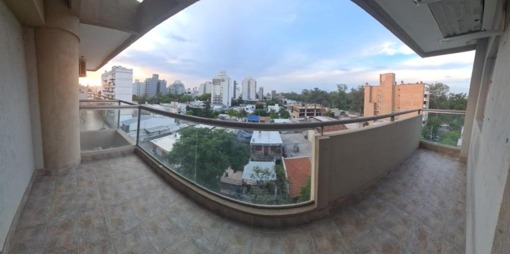 a balcony with a view of a city at Departamento centro Santiago del Estero in Santiago del Estero