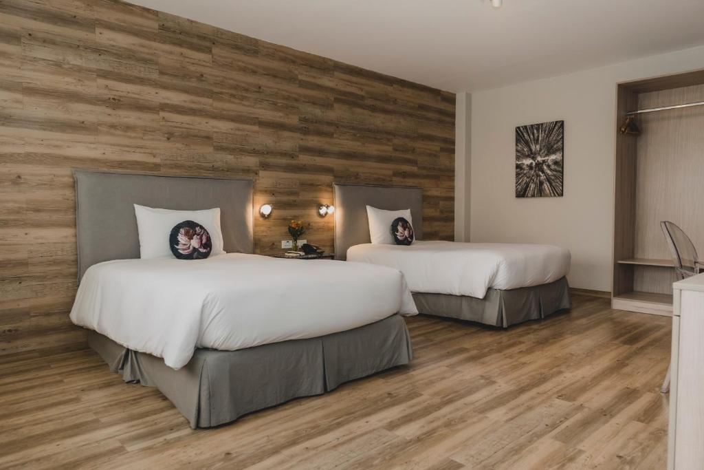 Postel nebo postele na pokoji v ubytování ARTE HOTEL Lima
