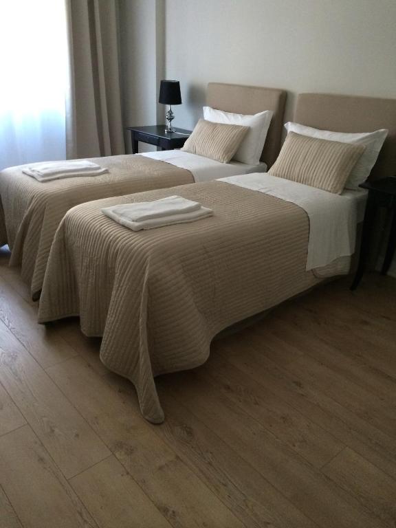 Łóżko lub łóżka w pokoju w obiekcie Vatican Holiday Home