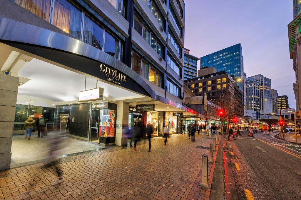 a city street with people walking on the sidewalk at Adina Citylife Wellington in Wellington