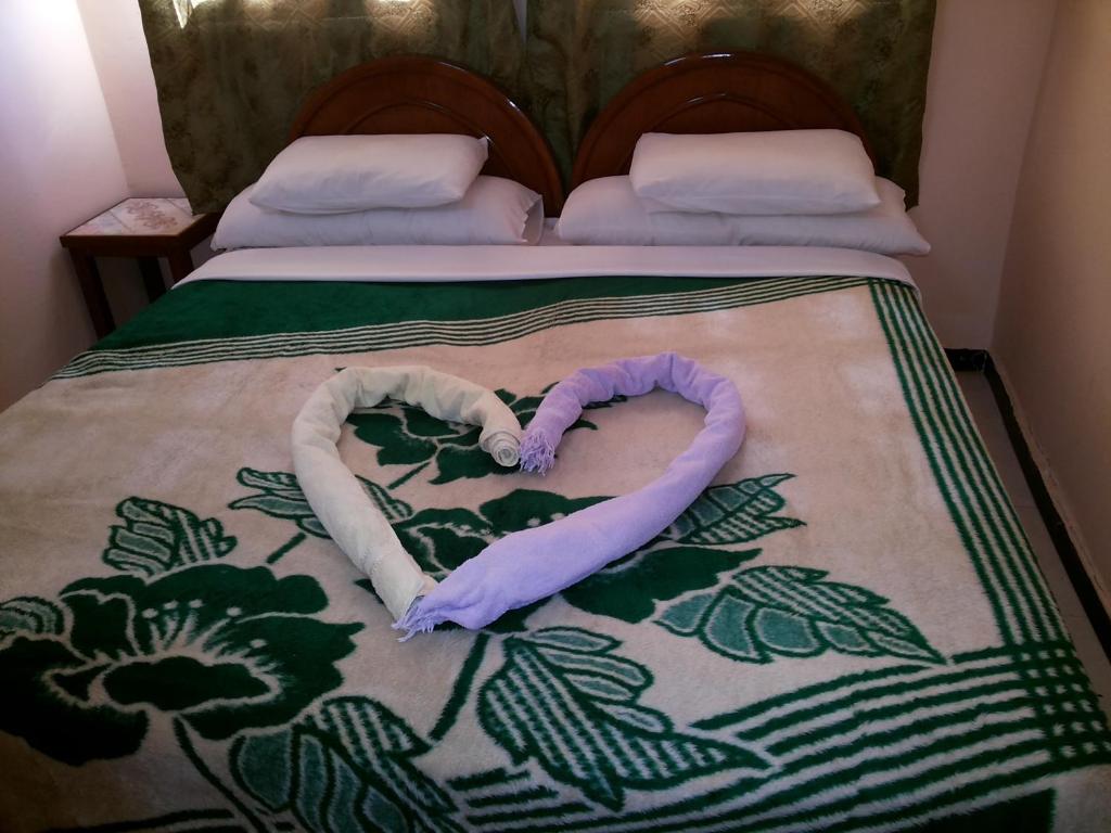 Postel nebo postele na pokoji v ubytování Amenophis Hotel