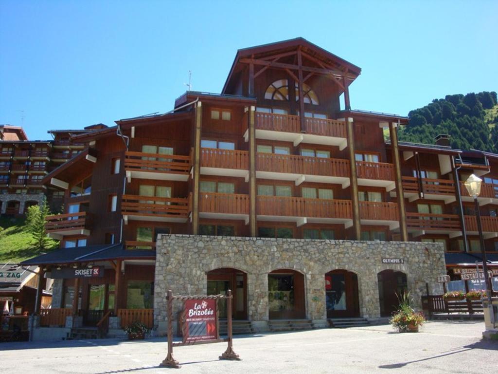 a large building with a sign in front of it at Appartement Méribel, 3 pièces, 6 personnes - FR-1-355-48 in Méribel