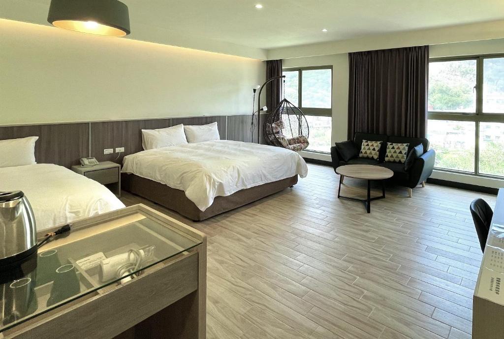 Postel nebo postele na pokoji v ubytování Long Fu Hotel