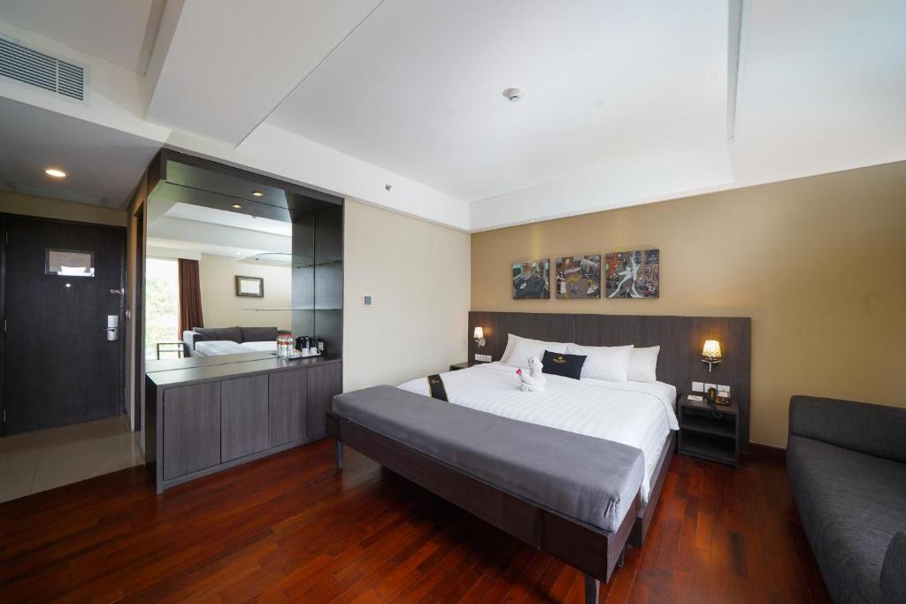Postel nebo postele na pokoji v ubytování Brits Hotel Legian