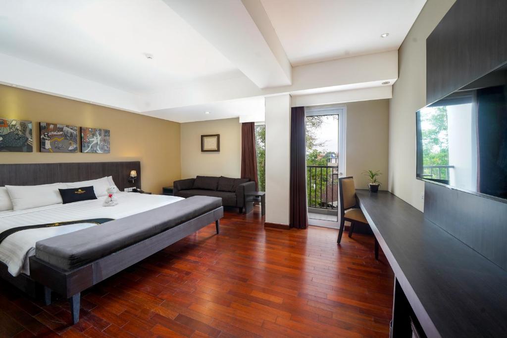 Postel nebo postele na pokoji v ubytování Brits Hotel Legian