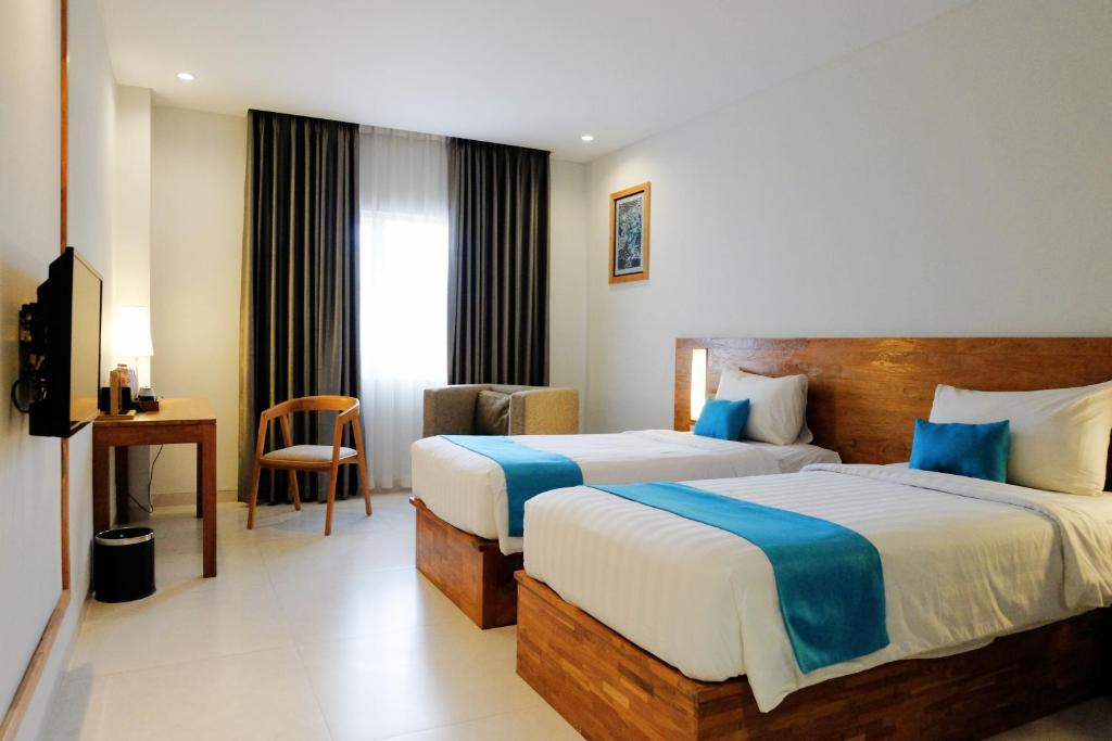 Postel nebo postele na pokoji v ubytování Pollos Hotel & Gallery