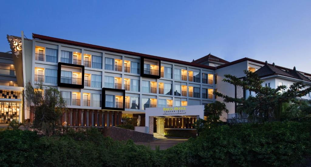 a large building with lights on at Brits Hotel Legian in Seminyak