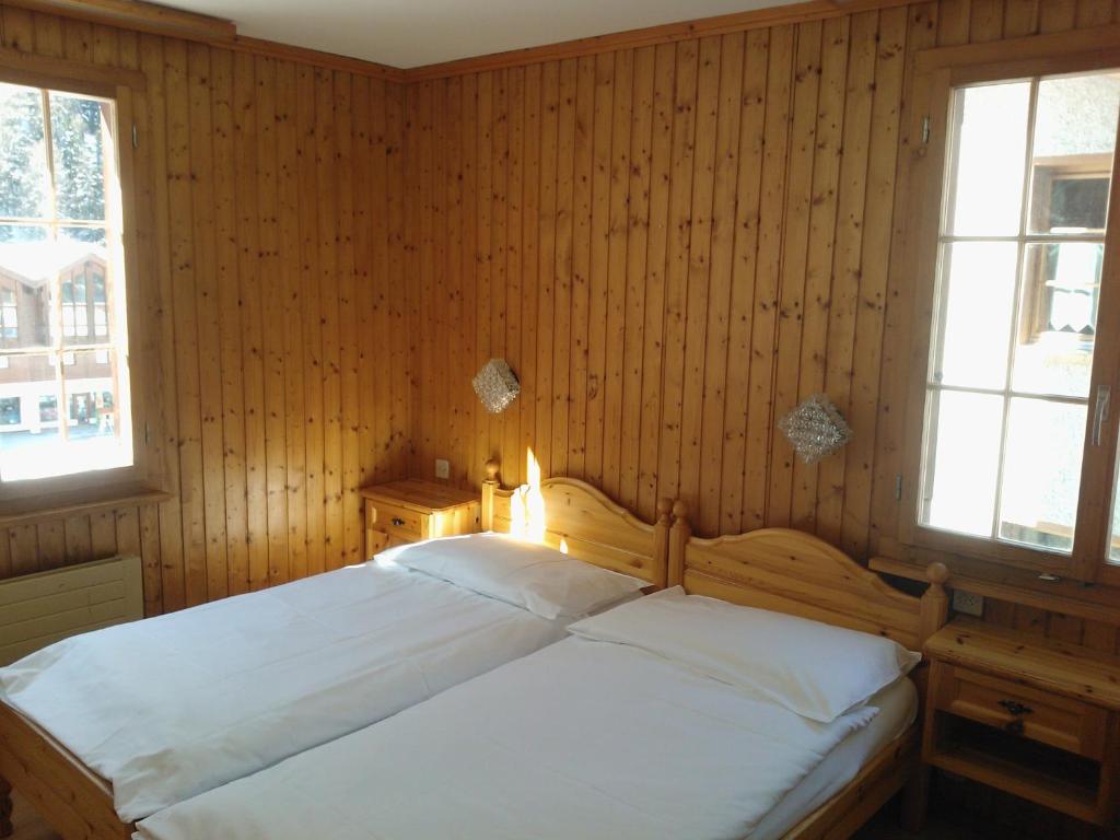 Postel nebo postele na pokoji v ubytování Hôtel - Petit-déjeuner Le Trift