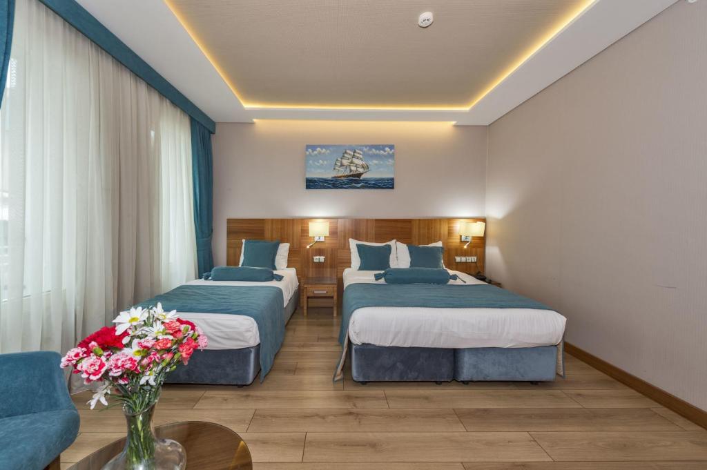 A bed or beds in a room at The Meretto Hotel Istanbul Old City