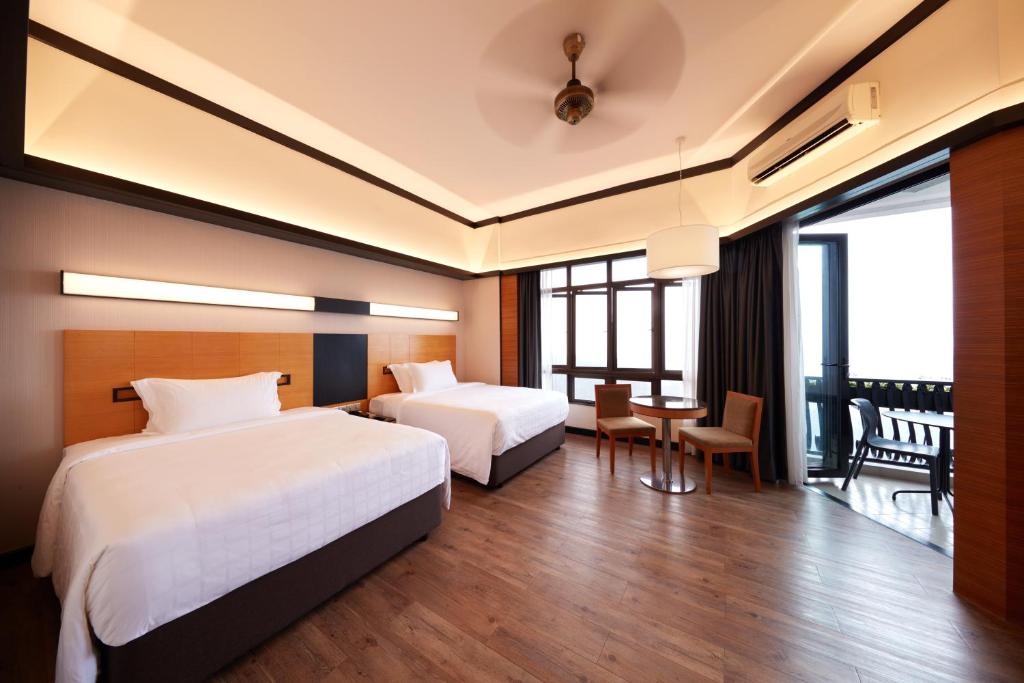 Postel nebo postele na pokoji v ubytování Resorts World Awana