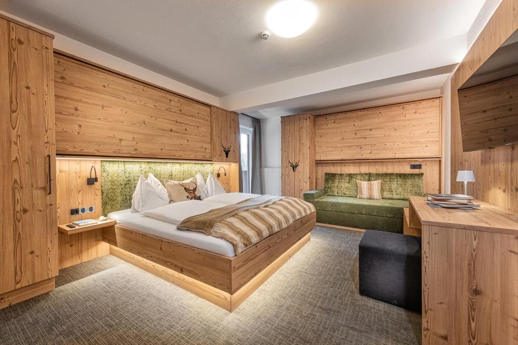 מיטה או מיטות בחדר ב-Jugendgästehaus Gruber