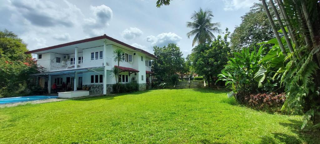 an image of a house with a yard at YoskY Indonesia in Bogor