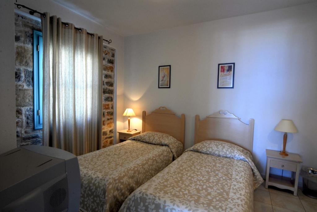 Postel nebo postele na pokoji v ubytování Mohlos Villas