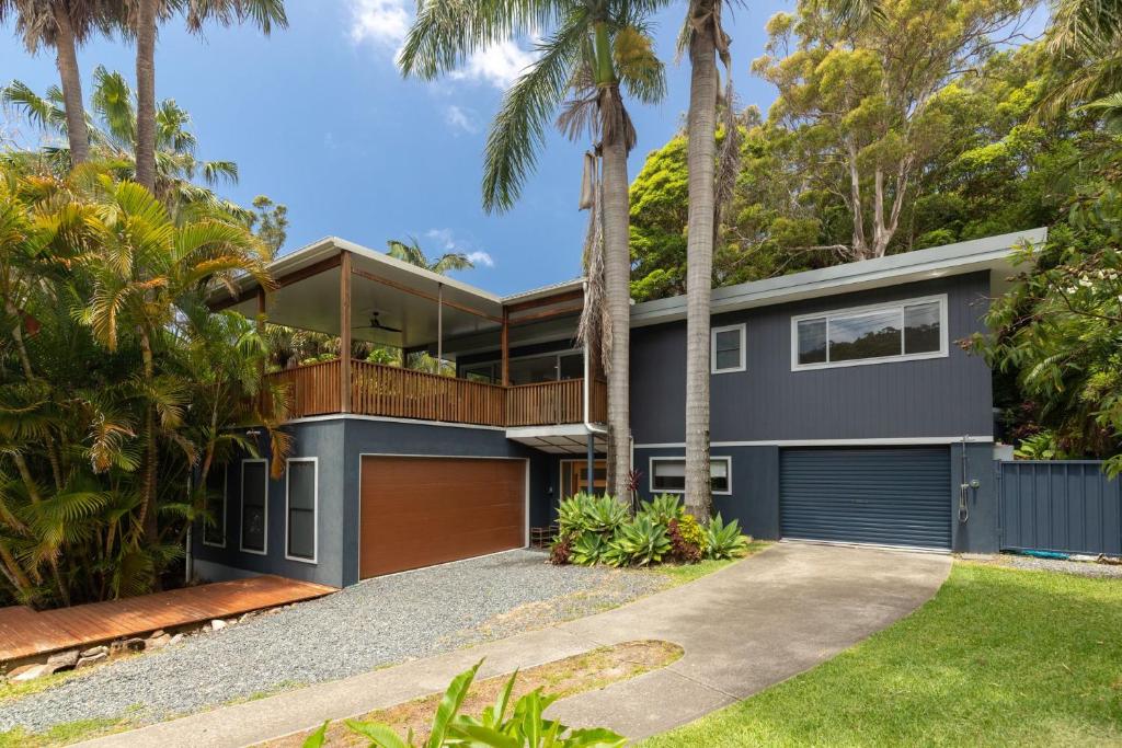 an image of a house with palm trees at The Royal Cuban in Elizabeth Beach